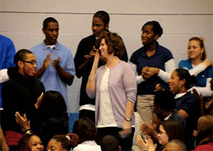 A teacher surrounded by students