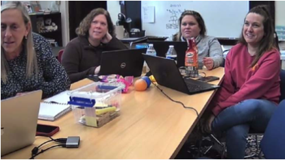 A group of teachers in a meeting