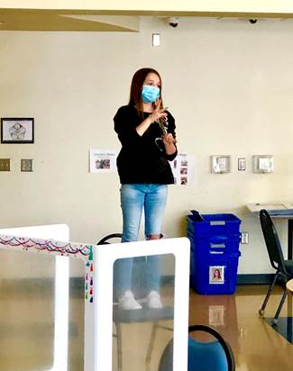 Woman on a chair signing